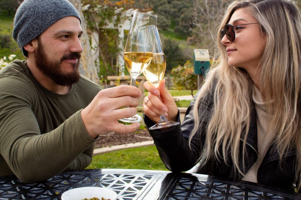 a couple enjoying wine at one of the best Santa Ynez Valley wineries